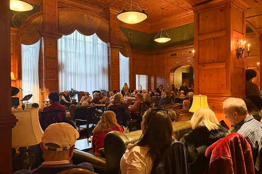 Guests are waiting for the jazz show to begin, in a full social lobby at O.Henry Hotel.