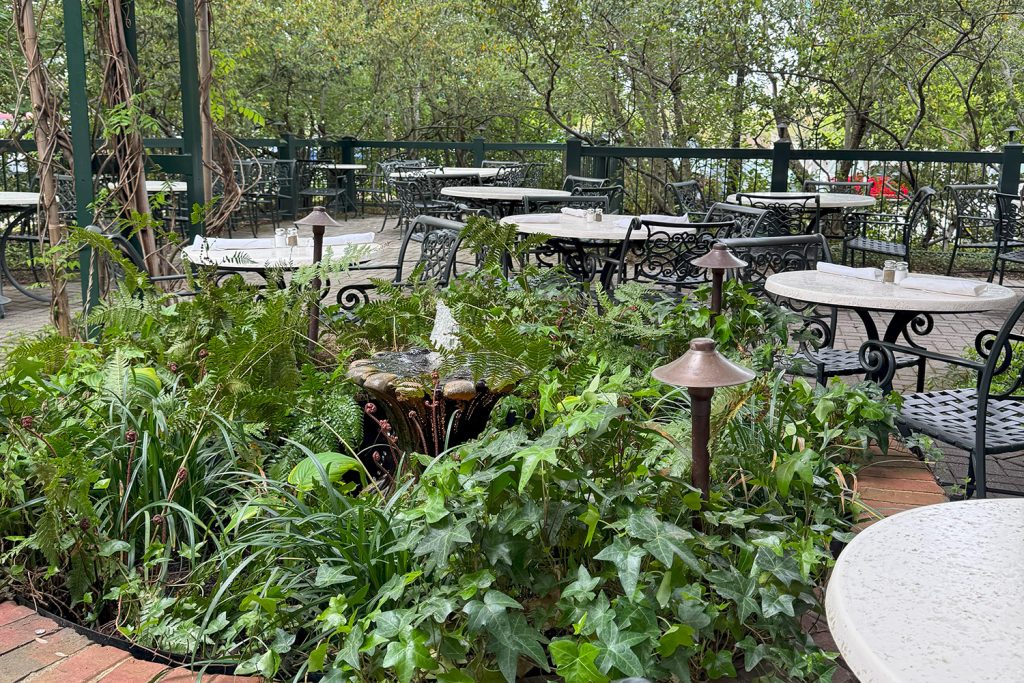 Green Valley Grill Courtyard with shade, fans, and a bubbling fountain.