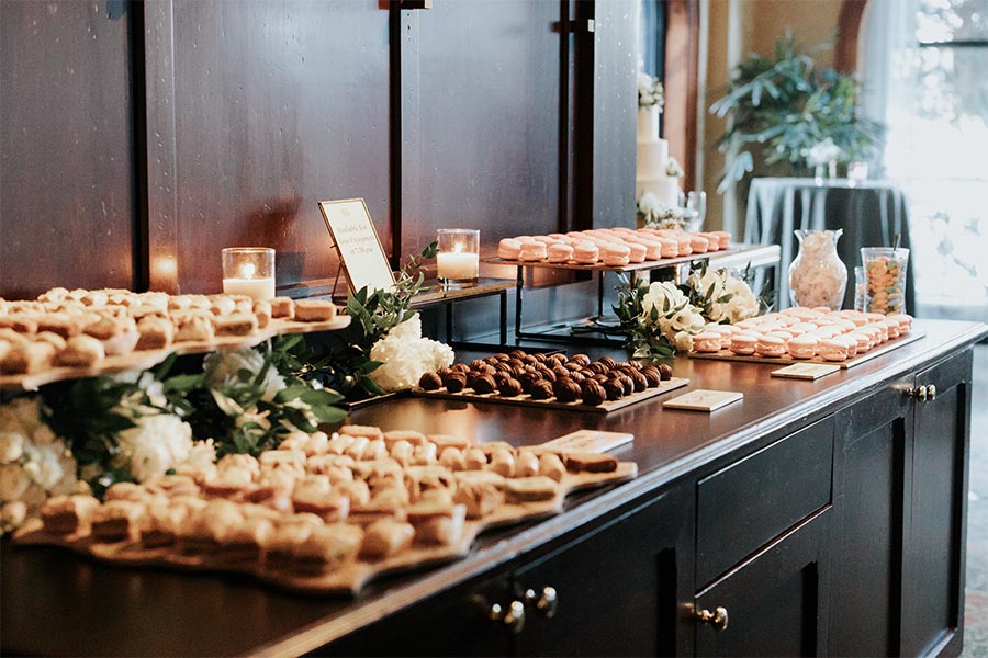 An assorted array of desserts displayed on an elegantly styled buffet.