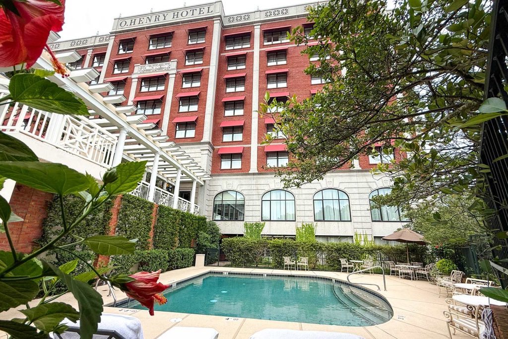 Outdoor Pool at O.Henry Hotel Outdoor Pool at O.Henry Hotel - Our outdoor pool is surrounded by lush landscaping and comfortable seating, is open from Memorial Day to Labor Day from 8:00 a.m. to 8:00 p.m. daily.