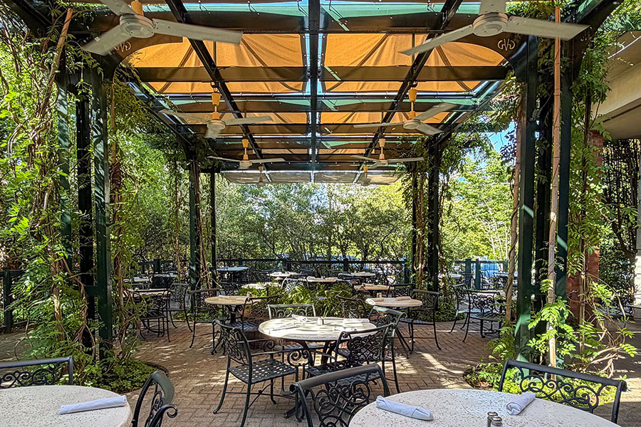 The GVG Courtyard Outdoor Dining offers Lush green foliage, a bubbling fountain, and breezy fans to keep guests cool.