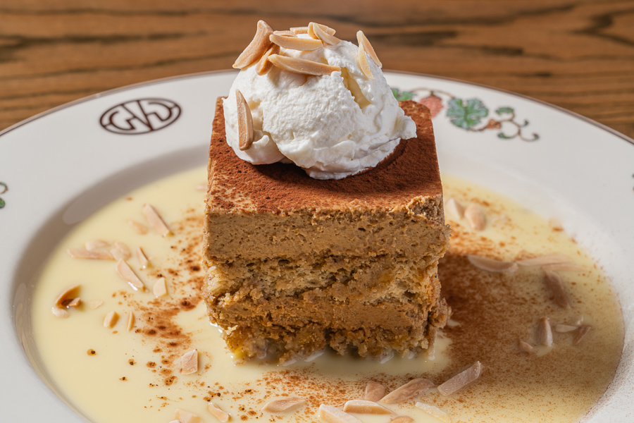Chai Latte Tiramisu, crème anglaise whipped cream, toasted almonds